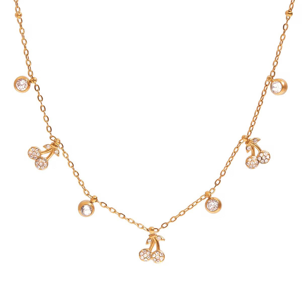 Gold necklace with cherry and circle charms on a white background